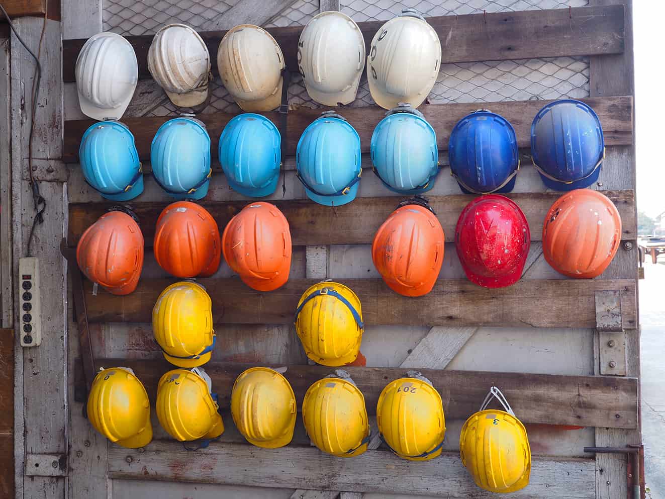Wall filled with hard hats